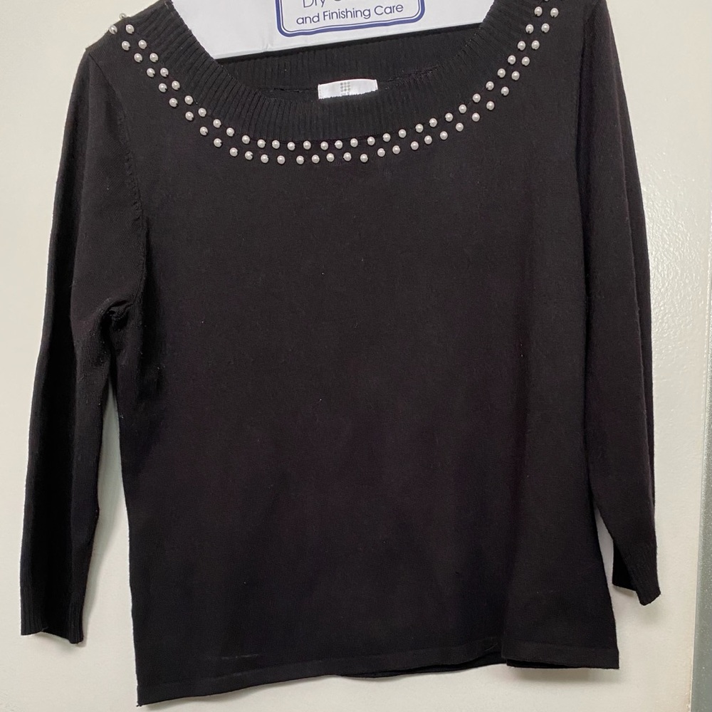 Women’s black sweater with quarter length sleeves